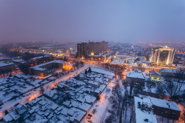 Fog, snowstorm at winter night in Voronezh. Aerial view