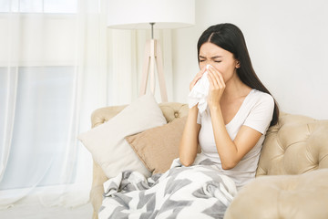 Sick woman lying in bed with high fever. Cold, flu, fever and migraine. In stress.