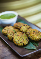 Vegetable pancakes with broccoli and sauce with greens, cabbage, honorable tasty spring dinner