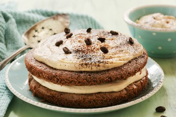 Homemade Coffee Expresso cake with  white chocolate mocha frosting, close up selective focus