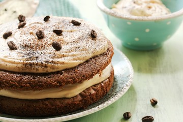 Homemade Coffee Expresso cake with  white chocolate mocha frosting, close up selective focus