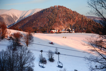 Ski resort. Mountains in the snow. Sunset in the mountains