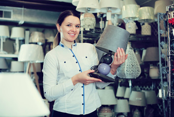 female is  holding  table lamps
