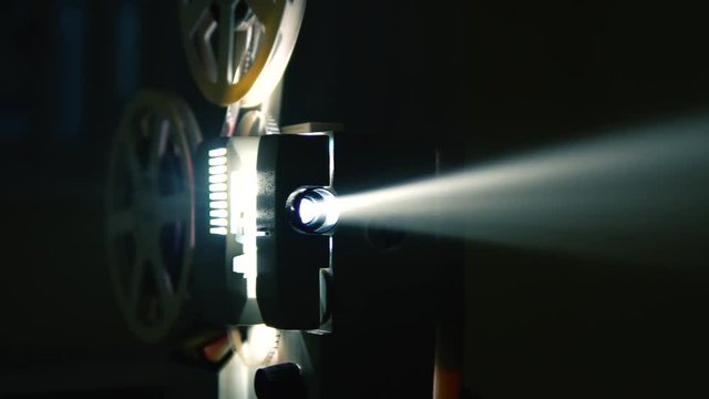 Cinema Film Projector with sound dip to white.
