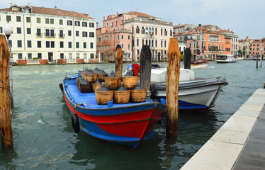 VENICE, ITALY - SEPTEMBER  24. 2017: Cargo Boats on  the busy Grand Canal , Venice Italy.