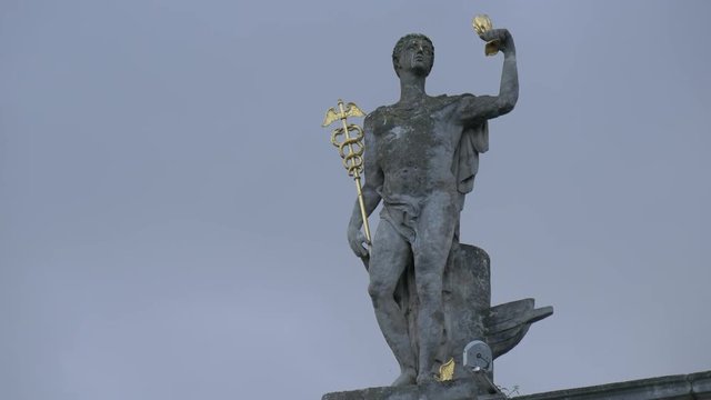 Mercury statue on a building