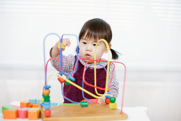 baby girl play abacus at home