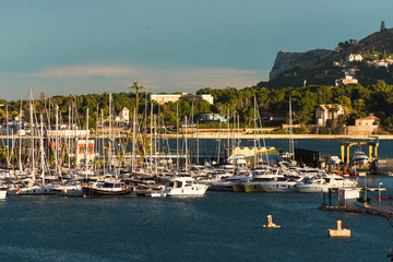 Fototapeta na wymiar Port of Denia with a parked boat view of the mountain.