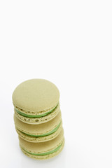 Fototapeta na wymiar Assorted macaroons over white background with reflection.