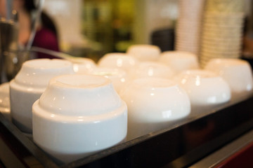 Tray with clean white cups close up
