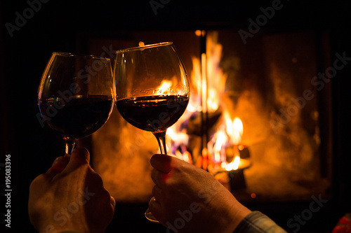 Couple Holding Pair Of Glasses With Wine At Fire Pit Stock Photo