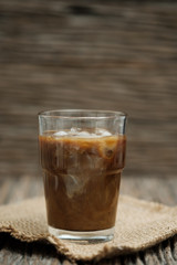 Classic still life a glass of coffee with copy space, vertical vintage picture.