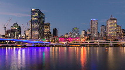 Fototapeta premium Brisbane CBD with skyscrapers reflecting in Brisbane river at night, Australia