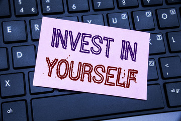Handwriting Announcement text showing Invest In Yourself. Business concept for Self Motivation written on sticky note paper on the black keyboard background.