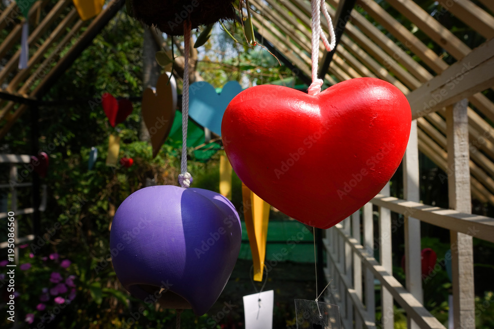 Wall mural close-up image of red heart mobile hanging in valentine day