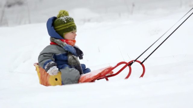 Baby on sleigh