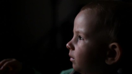 Lovely tired baby watching TV show, baby lost, modern education