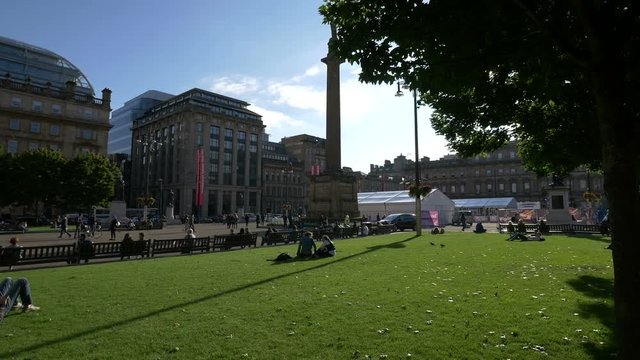 Relaxing on the grass in George Square, Glasgow
