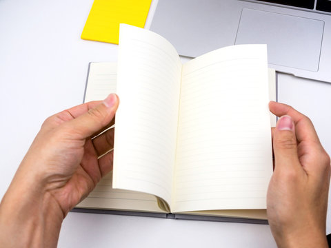 Flip and open notebook on desk