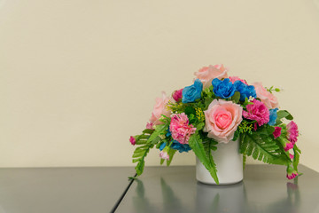 bouquet of flowers in a vase on wooden table