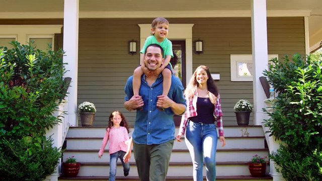 Father Gives Son Ride On Shoulders As Family Leave House