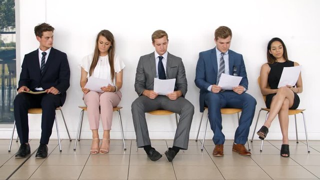Group Of Job Candidates Waiting For Interview In Office