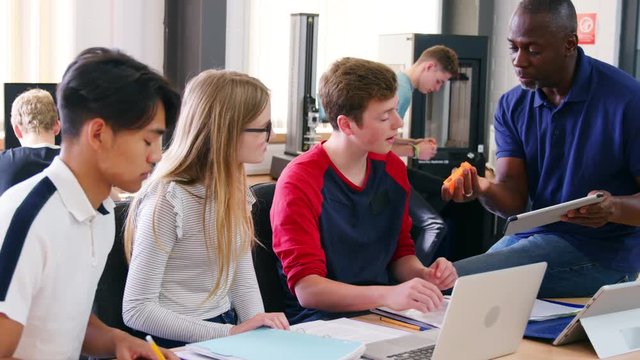 Design Students With Teacher Working In CAD/3D Printing Lab