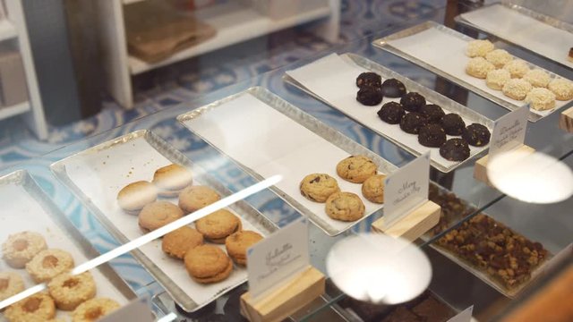 Cookies and sweets in a display cabinet at a shop