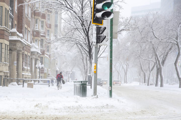 cyclist in a snow storm day