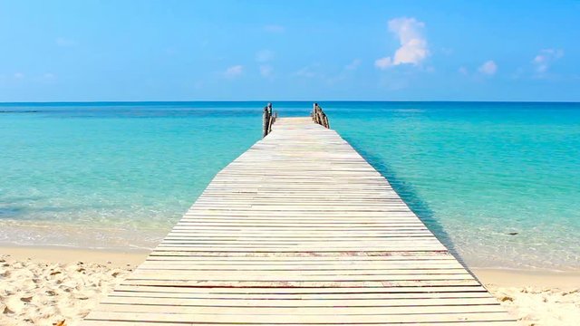 wooden walkway in the sea on tropical beach thailand