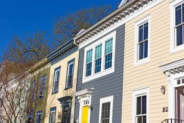 Historic houses in Shaw neighborhood on a quiet street. Colorful townhouses before sunset in Washington DC, USA
