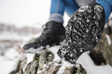 Sole of the trekking shoe with snow