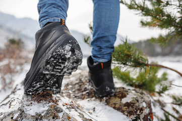 Boots going to the winter mountains