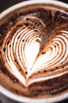 Hot chocolate drink with heart shape latte art
