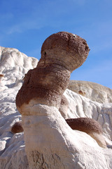 Strange, pitted, natural sandstone rocks in the desert badlands of Bisti/De Na Zin in Northern New Mexico