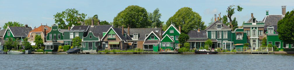 Traditional dutch houses near the canal in summer day. Netherlands