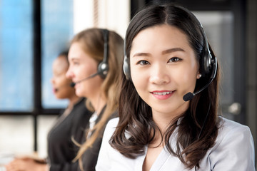 Asian woman customer service agent working in call center