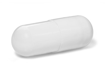 White capsule with medicine on a white background