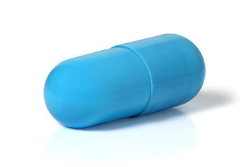 Blue capsule with medicine on a white background