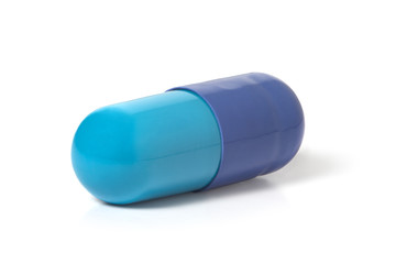 Blue capsule with medicine on a white background