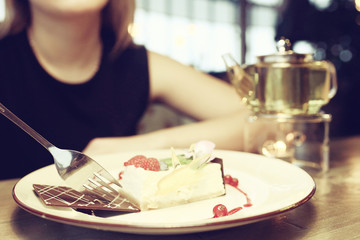 girl eating dessert in cafe