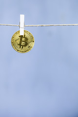 Bitcoin is hanging on a clothespin
