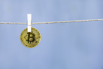 Bitcoin is hanging on a clothespin