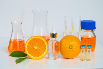 Vitamin C. Serum with Vitamin C,ampoules with vitamin c, syringes and vitamin C solution in laboratory flasks . beauty and health concept