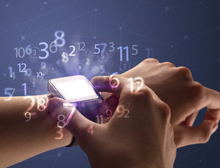 Close up hand with smartwatch and numbers