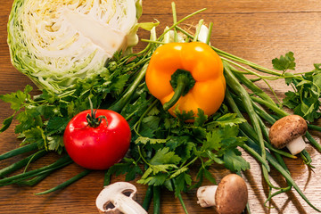 Set of fresh natural products with cabbage, pepper, tomato, mushrooms, onion and parsley