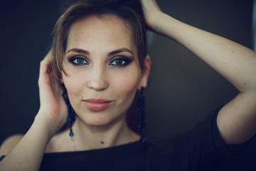 Fototapeta na wymiar glamor portrait of a girl with makeup and cosmetics