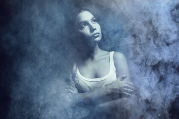 Fototapeta premium Portrait of a sexy girl with smoke