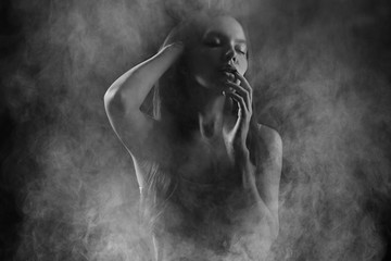 Portrait of a sexy girl with smoke - obrazy, fototapety, plakaty