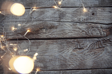 Light bulbs on light wooden background